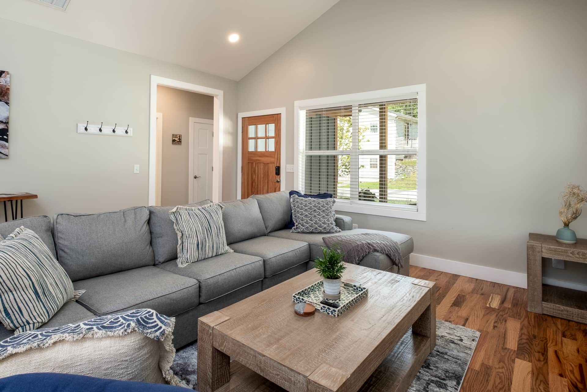 Living room from front entry with vaulted ceiling