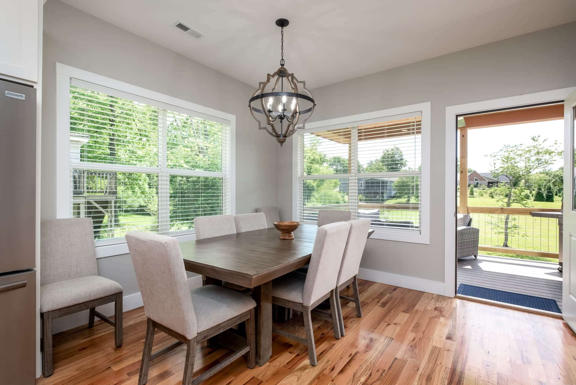 Dining area with chandelier and big windows