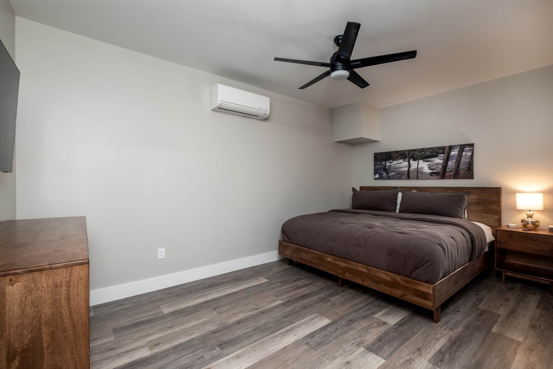 Lower-level bedroom with king bed