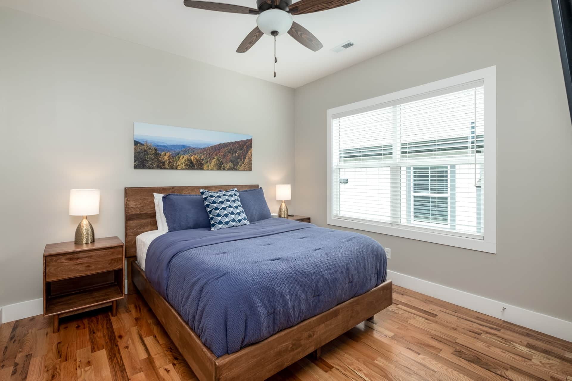 Lower-level bedroom with blue duvet