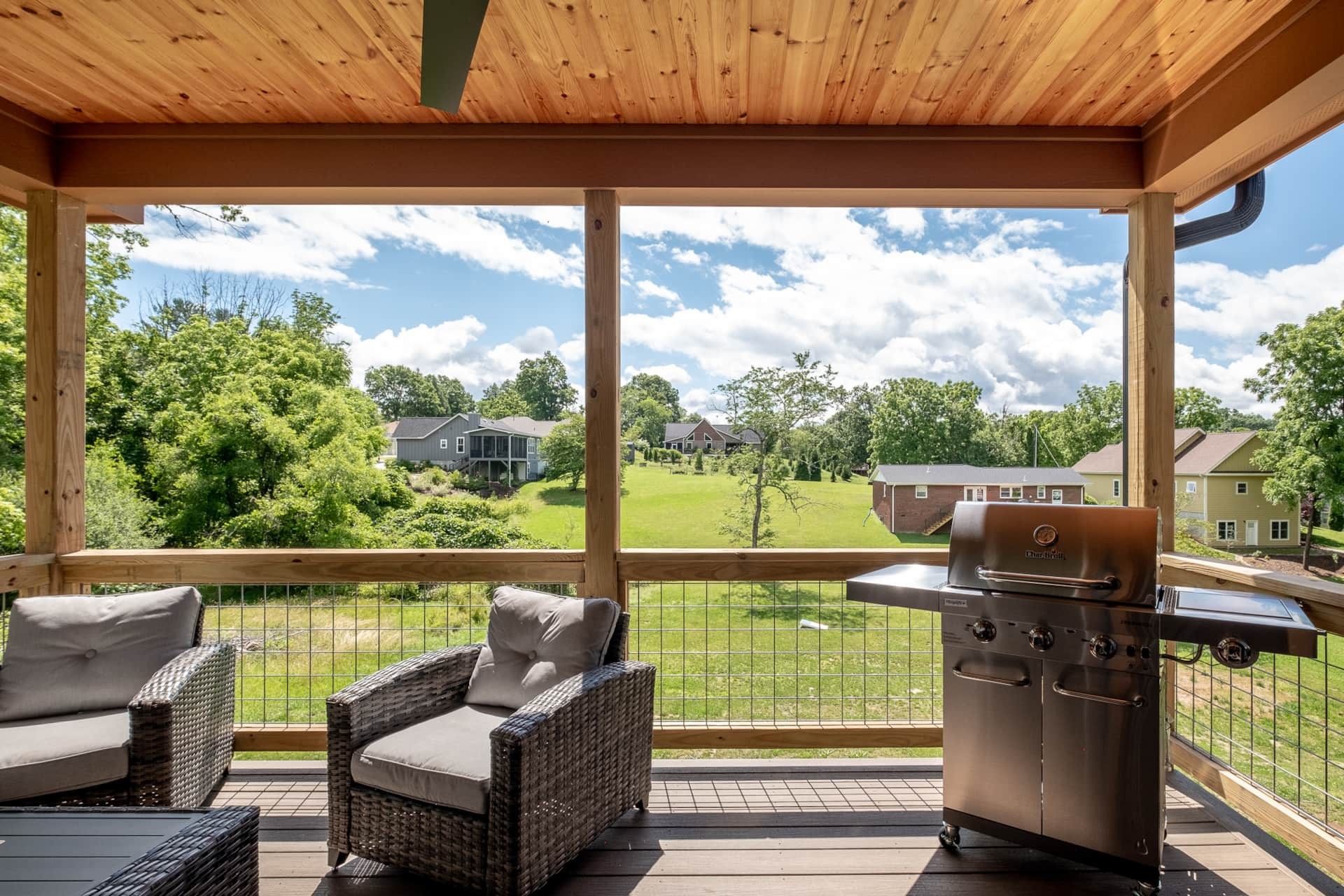 Covered upper porch with grill and mountain view
