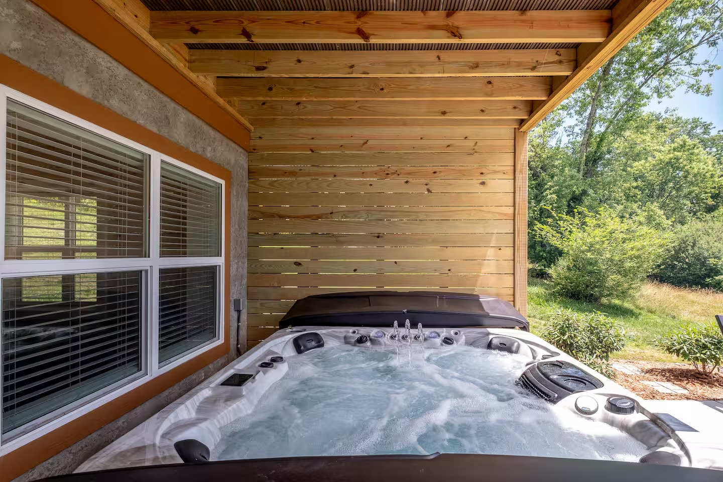 Hot tub close-up under cedar canopy