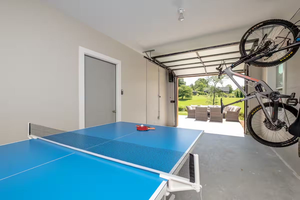 Ping pong table in garage with bike storage