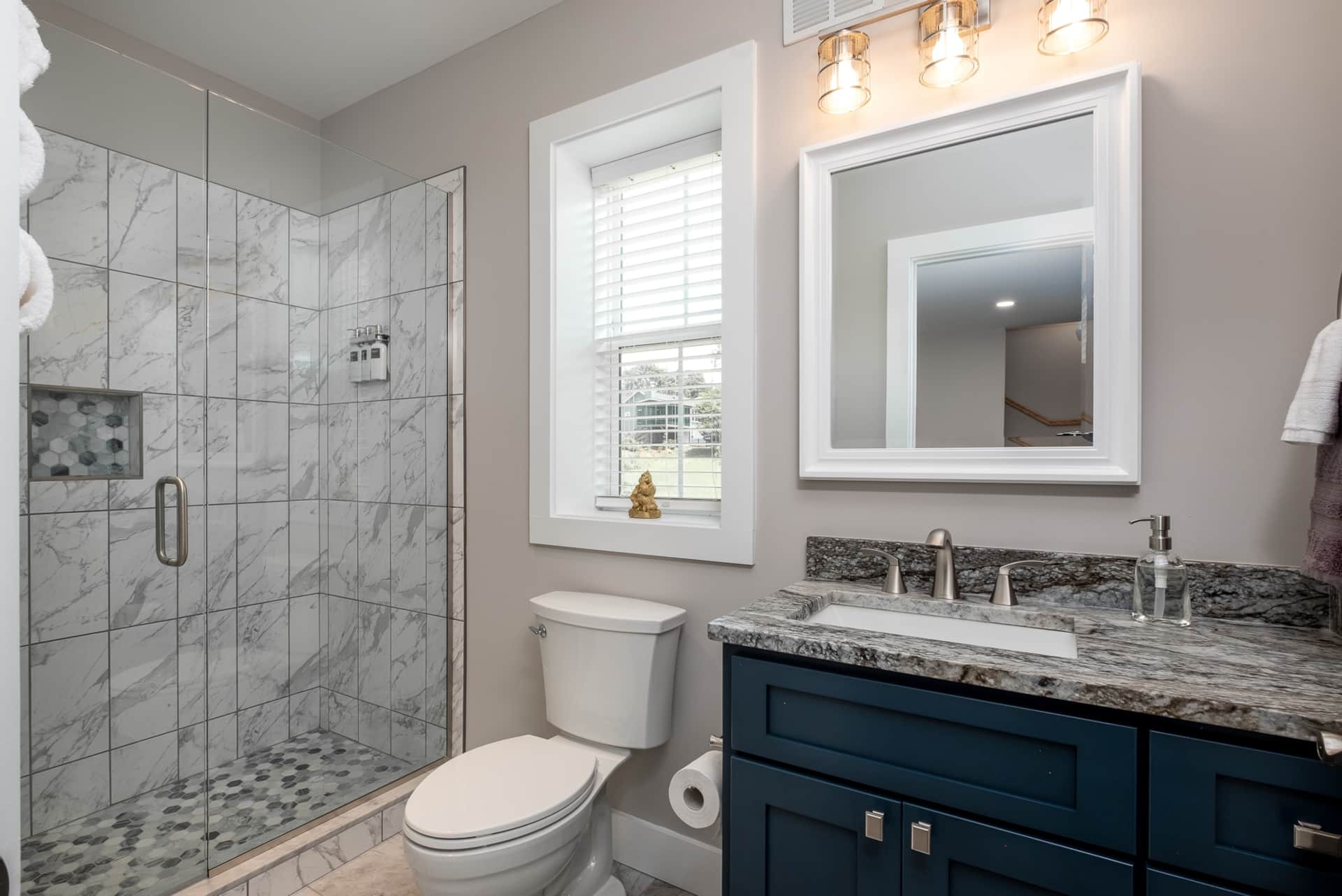 Bathroom with navy vanity