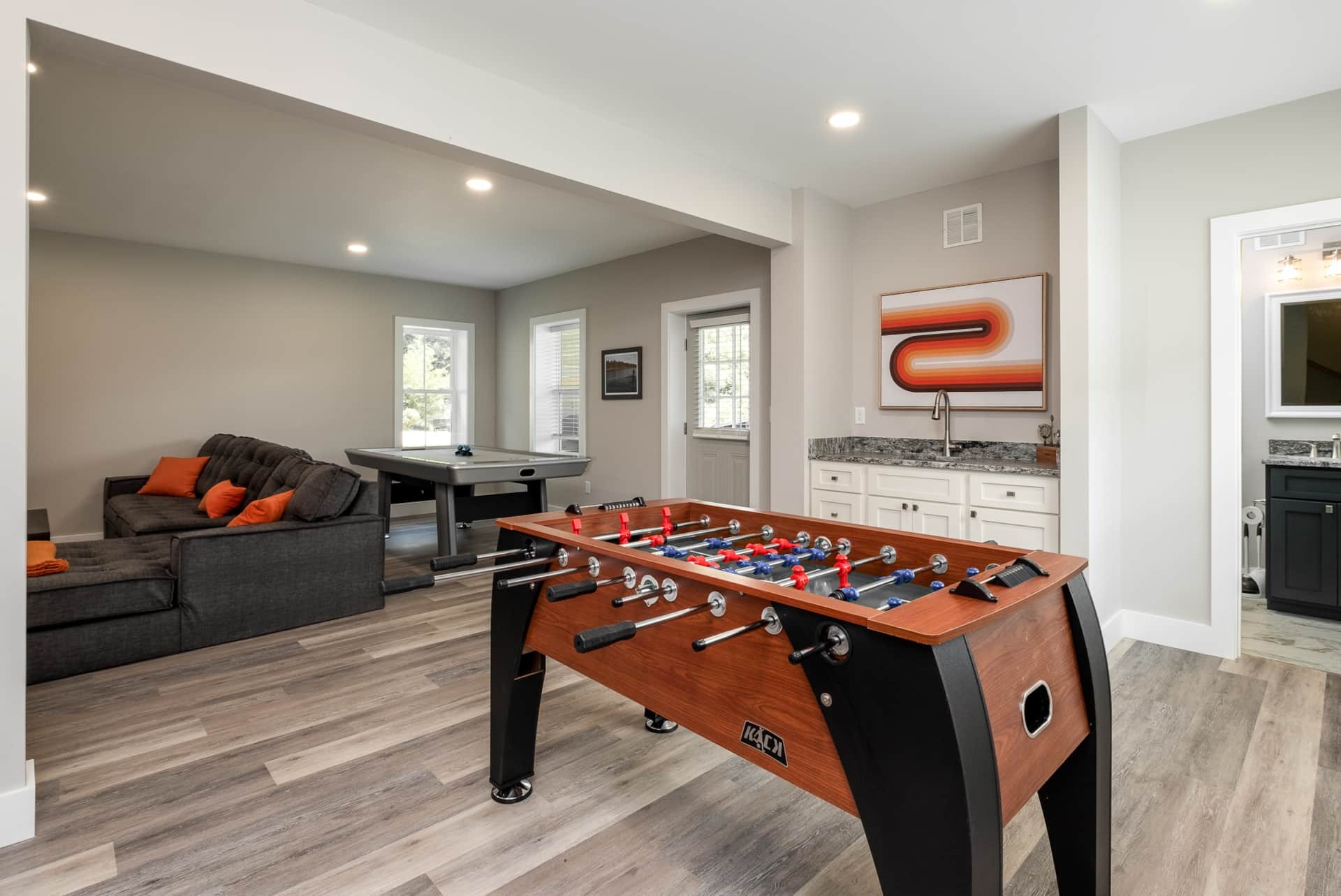 Game room with foosball, air hockey, and wet bar