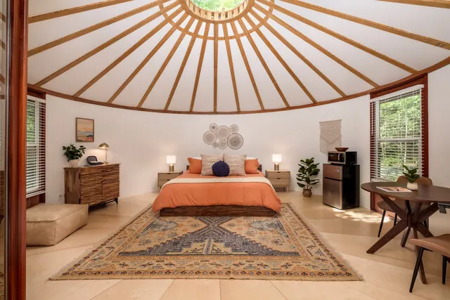 Creekside Yurt beside a flowing stream at Valley Bear Farms