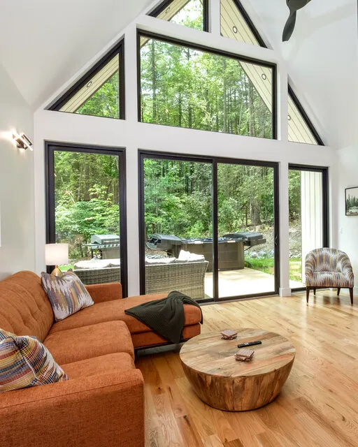 The Haven three-bedroom home with private hot tub and glass wall porch at Valley Bear Farms