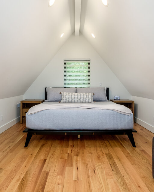 Lofted king bedroom with vaulted ceiling